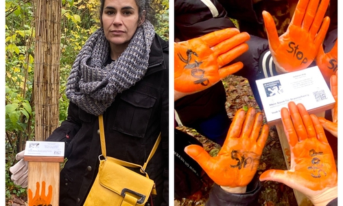 Hiam Stülten mit dem neuen Gedenkort. Viele orangene Hände unterstützten sie.