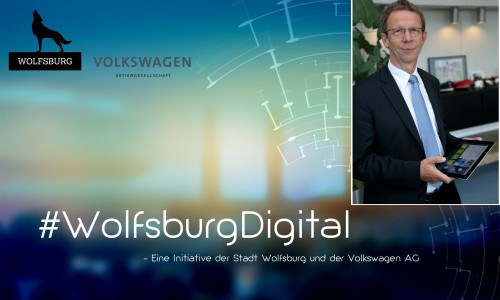 Oberbürgermeister Klaus Mohrs steht der Digitalisierung mit Tablet gegenüber. Foto: Stadt Wolfsburg.
