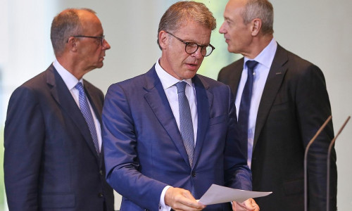 Friedrich Merz, Christian Sewing und Roland Busch am 21.07.2025