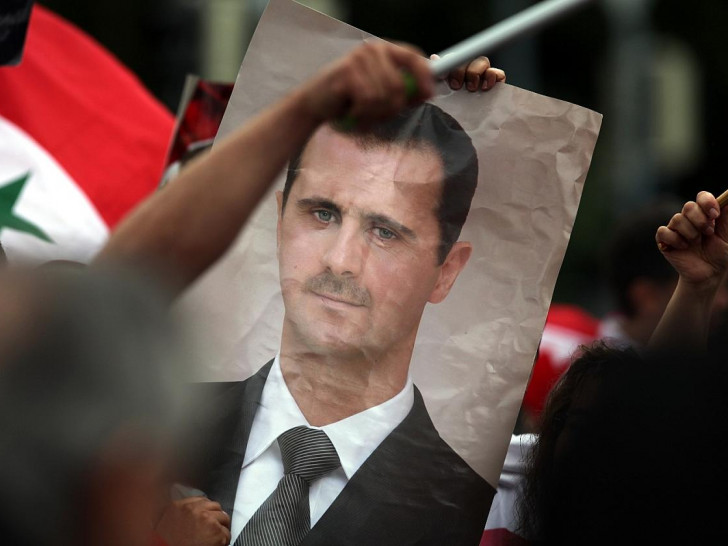 Bild von Baschar al-Assad auf einer Syrien-Demonstration (Archiv)